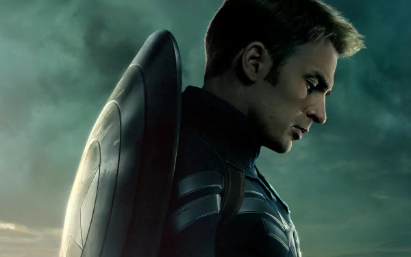 A dramatic HD wallpaper featuring Captain America from Captain America: The Winter Soldier, showcasing his profile against a moody, atmospheric background.