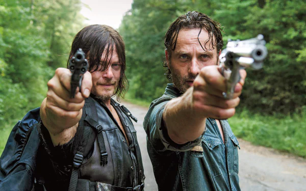 HD desktop wallpaper of Daryl Dixon and Rick Grimes from The Walking Dead, portrayed by Norman Reedus and Andrew Lincoln, aiming guns in a forest setting.