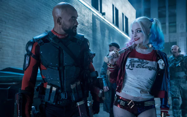 HD wallpaper featuring Margot Robbie as Harley Quinn and Will Smith as Deadshot from the movie Suicide Squad. Harley holds a bat, while Deadshot wears tactical gear in a dimly lit urban setting.
