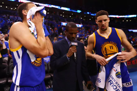 Golden State Warriors players Stephen Curry and Klay Thompson are being interviewed after a game, showcasing the intensity of sports in this HD desktop wallpaper.