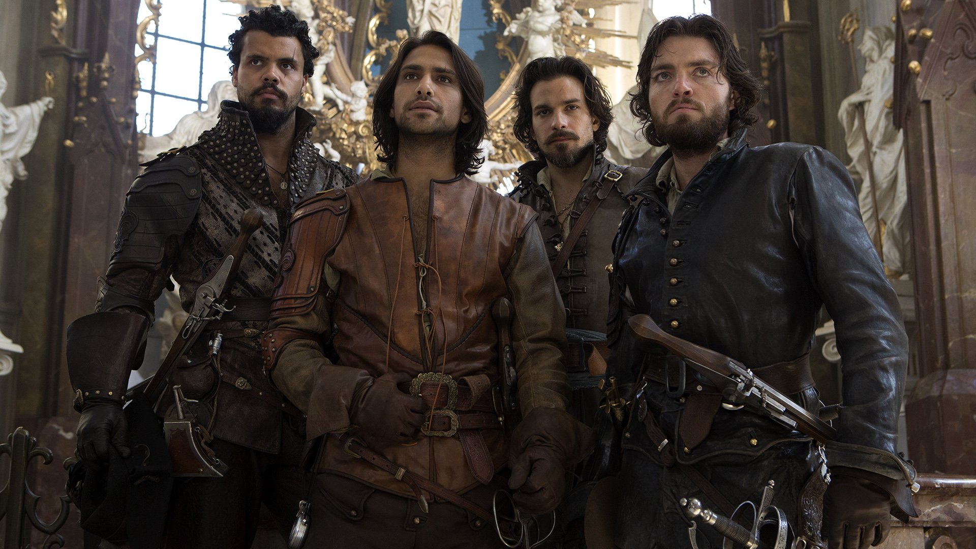 HD PC desktop wallpaper of four leather-clad musketeers from the TV show The Musketeers, standing with swords in an ornate hall, faces set with resolve.