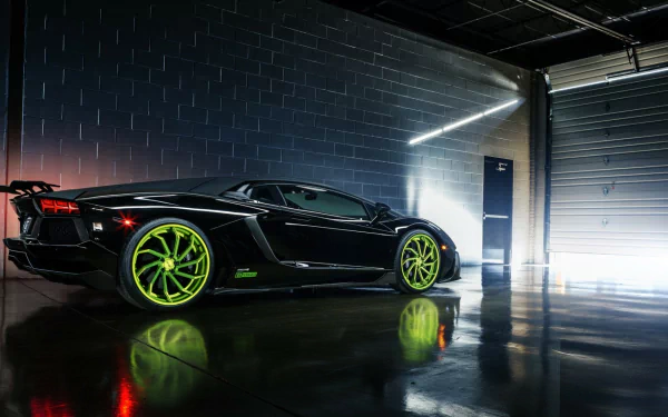 A striking black Lamborghini Aventador LP 700-4 showcases its sleek design and bold green wheels against a dark, industrial backdrop, perfect as a high-definition desktop wallpaper.