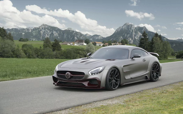A stunning Mercedes-AMG GT parked on a scenic road, with mountains in the background, captured in high-definition for an impressive desktop wallpaper.
