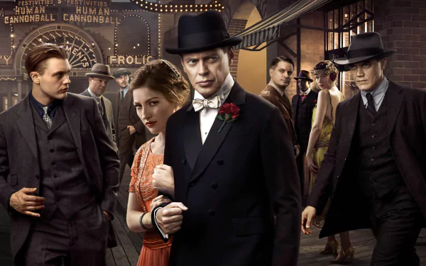 HD desktop wallpaper featuring characters from the TV show Boardwalk Empire dressed in 1920s attire on a boardwalk at night.
