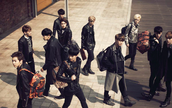 HD desktop wallpaper featuring the members of Exo in stylish outfits walking confidently with a city backdrop.