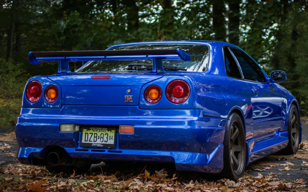 close-up Nissan Skyline GT-R R34 vehicle Nissan Skyline GT-R HD Desktop Wallpaper | Background Image