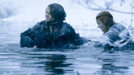 HD Game of Thrones desktop wallpaper featuring Theon Greyjoy (Alfie Allen) and Sansa Stark (Sophie Turner) in a tense water scene from the TV show.
