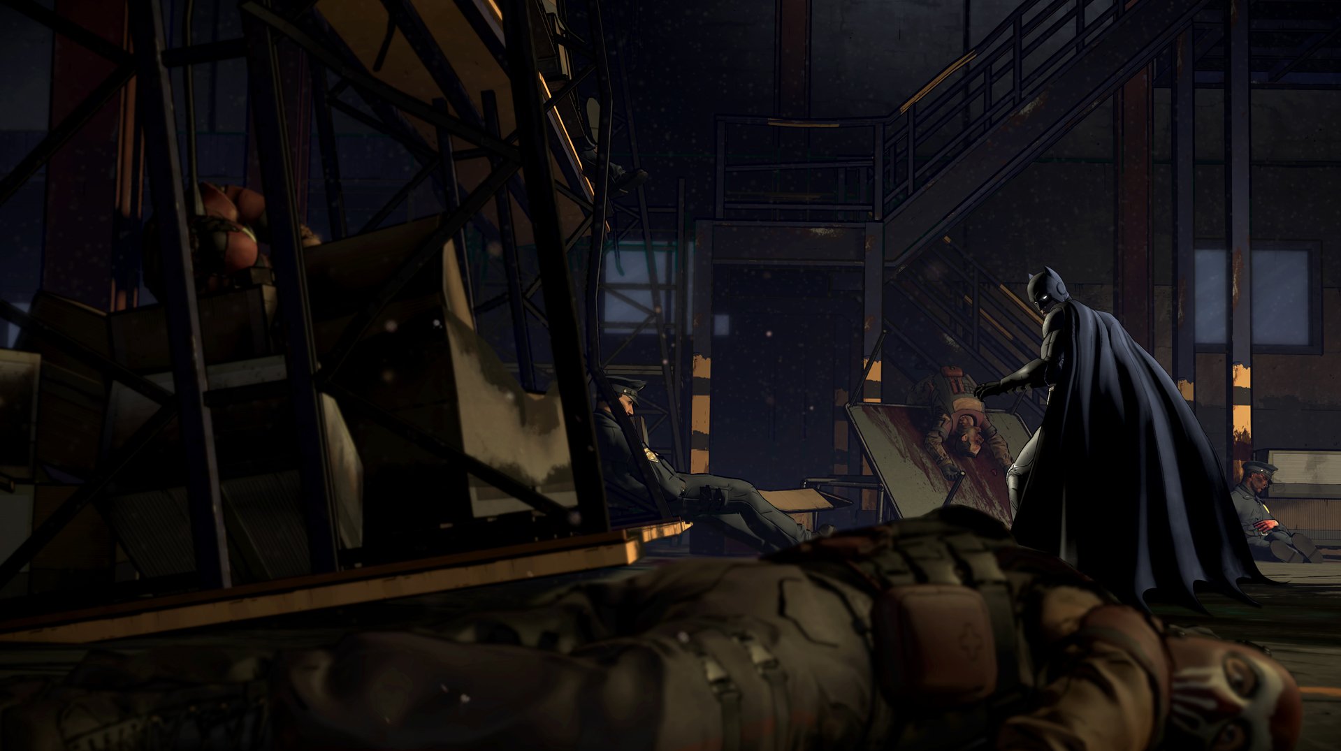 HD PC desktop wallpaper of Bruce Wayne as Batman from the video game Batman – The Telltale Series, cape-cloaked in a dim warehouse surrounded by fallen thugs.