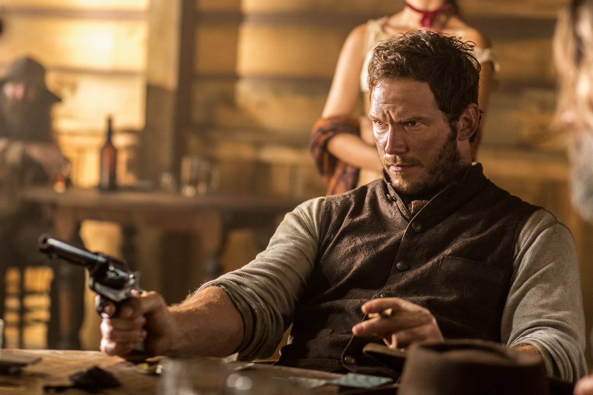 Chris Pratt as one of The Magnificent Seven in a tense scene from the 2016 movie, captured in a detailed 4K Ultra HD PC desktop wallpaper.