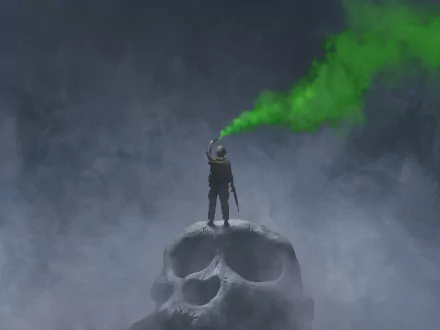 HD desktop wallpaper from the movie Kong: Skull Island, featuring a figure standing atop a giant skull with green smoke against a misty background.