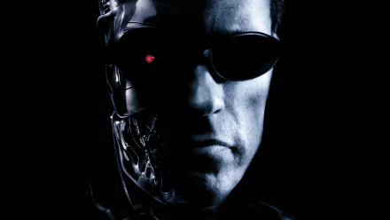 A striking HD wallpaper featuring Arnold Schwarzenegger as the Terminator from Terminator 3: Rise of the Machines, showcasing his iconic cyborg visage and intense expression.