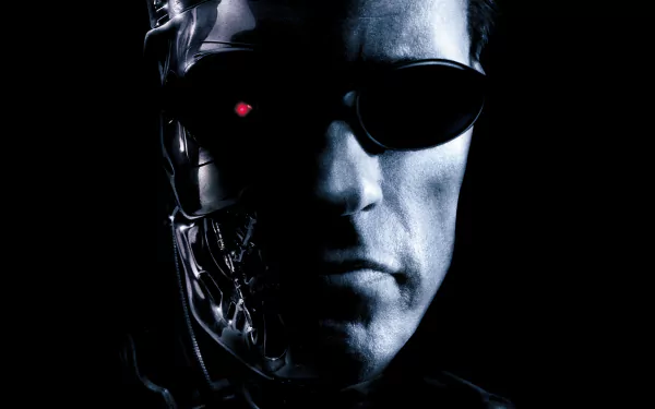 A striking HD wallpaper featuring Arnold Schwarzenegger as the Terminator from Terminator 3: Rise of the Machines, showcasing his iconic cyborg visage and intense expression.