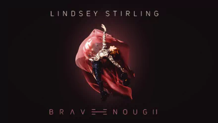 A striking HD desktop wallpaper featuring Lindsey Stirling, showcasing her dynamic pose and vibrant costume against a dark background, accompanied by the text BRAVE ENOUGH.