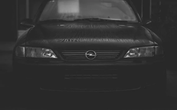 Front view of a black Opel Vectra car, captured in a moody, low-light setting as an HD PC desktop wallpaper and background.