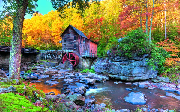 A vibrant fall scene featuring a rustic watermill beside a rocky stream, surrounded by colorful autumn foliage, captured in stunning 8K Ultra HD.