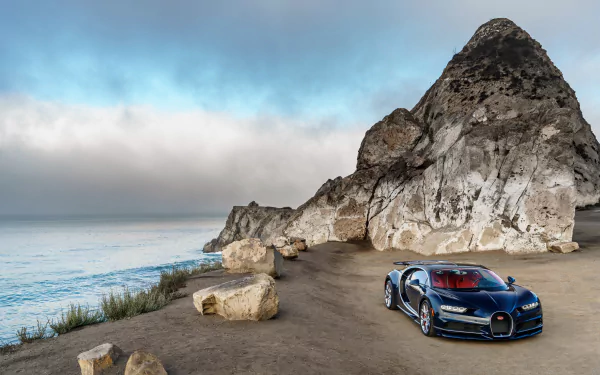 A sleek Bugatti Chiron parked along a rugged coastline, with the ocean waves lapping at the shore and dramatic cliffs in the background, creating a stunning HD desktop wallpaper.