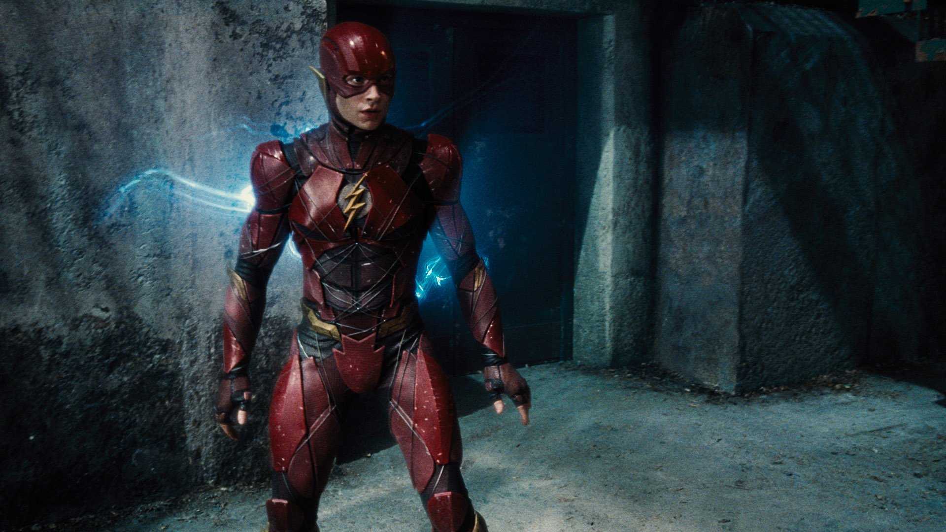 Ezra Miller as The Flash in this striking HD wallpaper from the DC Comics movie Justice League, featuring dynamic colors and intense action.