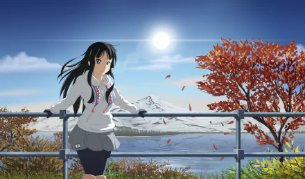 A serene HD desktop wallpaper featuring Mio Akiyama from K-ON!, standing by a railing with autumn foliage and a mountain backdrop under a bright sun.