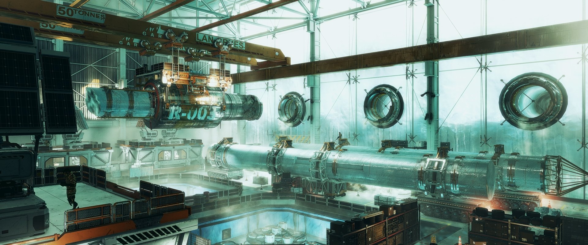 Deus Ex: Mankind Divided 4K Ultra HD PC wallpaper — high-tech industrial hangar with suspended machinery, chrome tubes, cranes and teal-green ambient light.