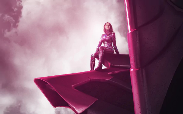 A striking 4K image features Kimberly Hart as the Pink Ranger from the 2017 Power Rangers movie, confidently perched on a Zord amidst dramatic clouds.