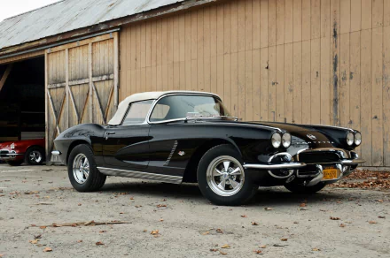 HD PC desktop wallpaper: black 1962 Chevrolet Corvette convertible hot rod muscle car parked in front of a weathered barn.