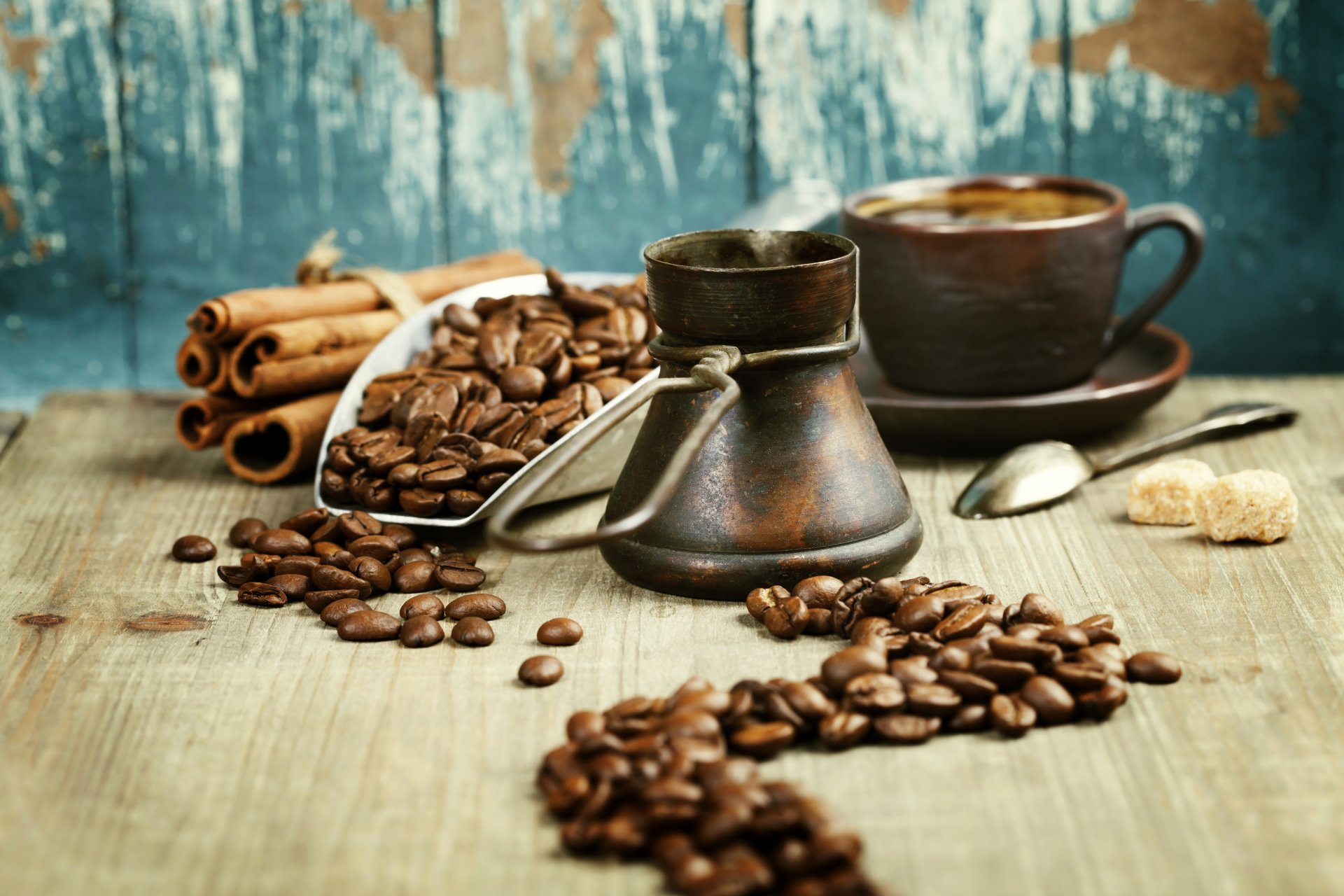 5K Ultra HD PC desktop wallpaper still life food: coffee beans, cinnamon sticks, a cezve and cup of coffee on a rustic table.