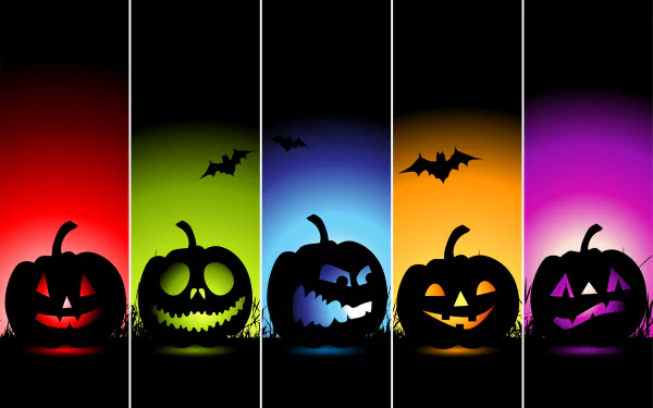 HD PC desktop wallpaper featuring colorful jack-o'-lantern pumpkins with glowing faces and bats, capturing the festive Halloween holiday spirit.