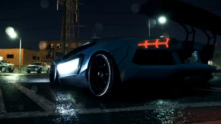 HD PC desktop wallpaper featuring a Lamborghini Aventador from the 2015 Need For Speed video game, showcasing its sleek design and illuminated rear lights on a wet street.