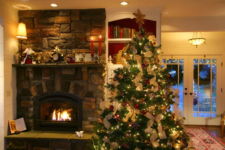 HD PC desktop wallpaper showcasing a cozy holiday scene with a decorated Christmas tree beside a lit fireplace in a warm, festive living room.