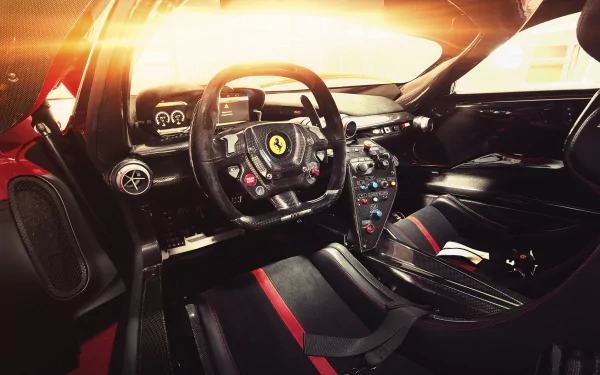 Ferrari FXX K cockpit: carbon-fiber steering wheel with prancing horse, racing seats and illuminated dash — 2K Quad HD PC desktop wallpaper/background.