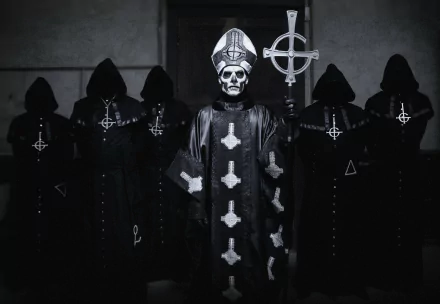 HD desktop wallpaper featuring Ghost B.C., a heavy metal band, with members in dark, gothic attire and a prominent skeletal figure holding a staff in the center.