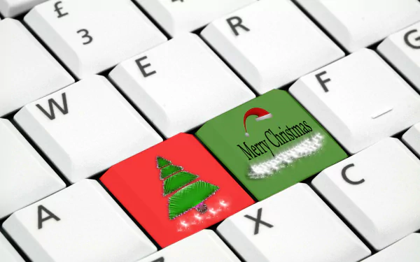 HD PC desktop wallpaper featuring a white keyboard with festive red and green keys displaying a Christmas tree and Merry Christmas holiday greeting.