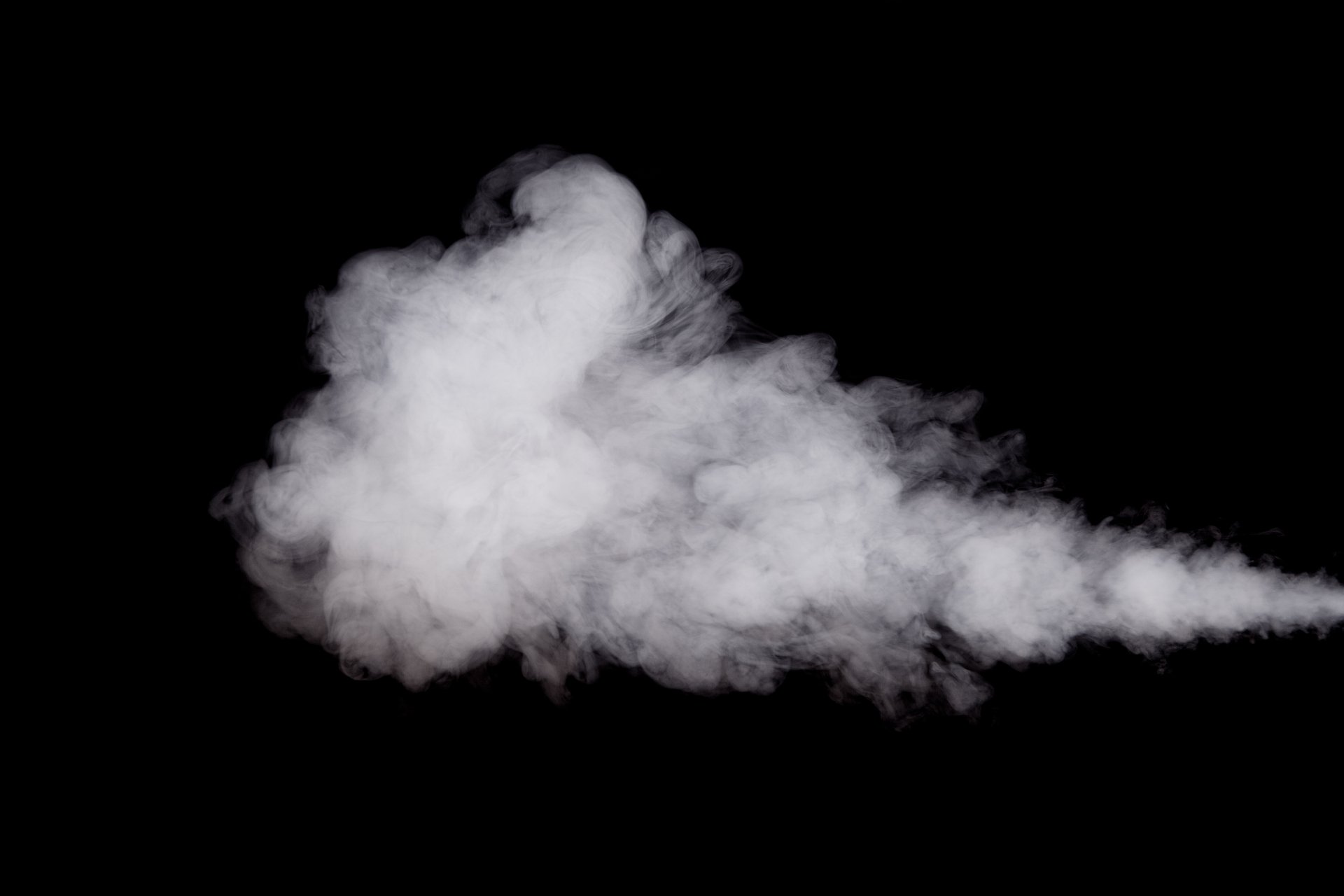 Abstract white smoke swirling against a black background, captured in 4K Ultra HD as a striking PC desktop wallpaper and background.