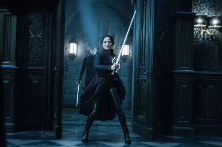 HD PC desktop wallpaper featuring a scene from the movie Underworld: Blood Wars with a fierce character holding a sword in a dark, gothic interior.