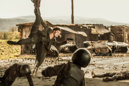 HD wallpaper featuring Milla Jovovich as Alice in an action scene from Resident Evil: The Final Chapter, surrounded by fallen enemies in a post-apocalyptic setting.