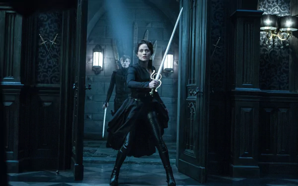 HD PC desktop wallpaper featuring a scene from the movie Underworld: Blood Wars with a fierce character holding a sword in a dark, gothic interior.