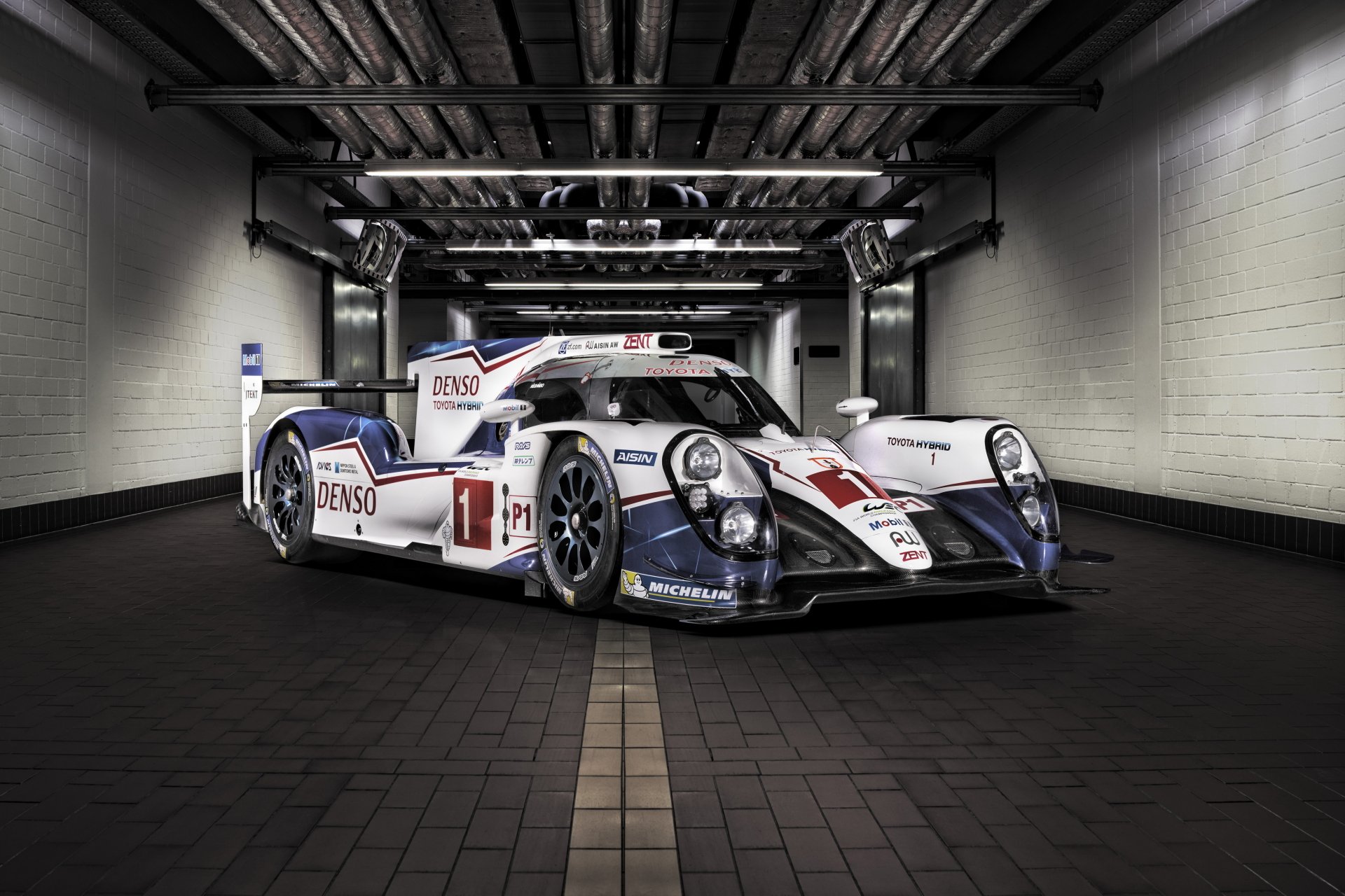 Toyota TS040 Hybrid race car in a dim garage, presented as a 4K Ultra HD PC desktop wallpaper and background highlighting the endurance-racing vehicle.