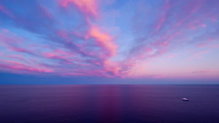 HD PC desktop wallpaper: pink-and-blue sunset sky with wispy clouds above a calm ocean horizon.
