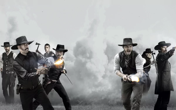 HD PC desktop wallpaper featuring an intense gunfight scene from the 2016 movie The Magnificent Seven, showing seven armed men in western attire against a smoky background.