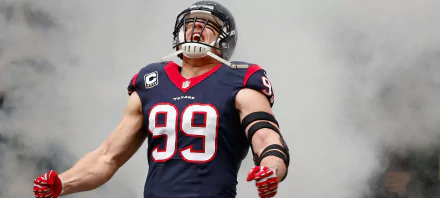 HD wallpaper featuring J.J. Watt in a Houston Texans #99 jersey against a cloudy sky background.