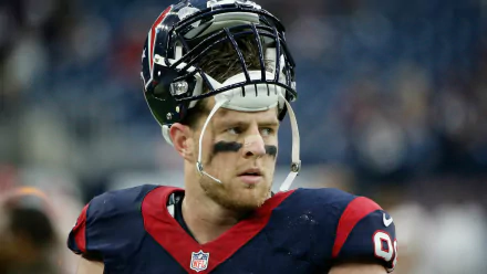 J.J. Watt in action, showcasing his intensity on the field. This HD desktop wallpaper captures the spirit of sports and the passion of football fans.