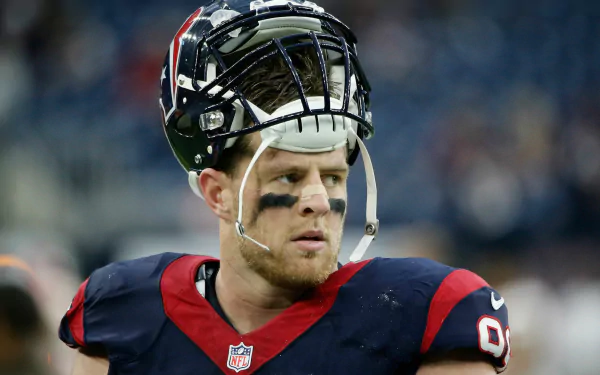 J.J. Watt in action, showcasing his intensity on the field. This HD desktop wallpaper captures the spirit of sports and the passion of football fans.