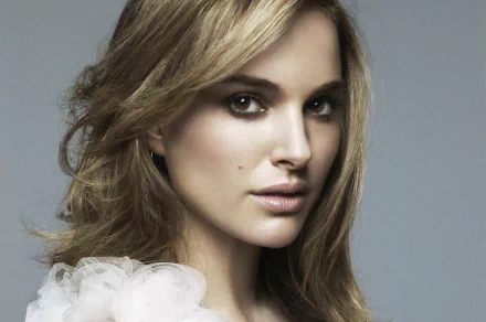 An HD desktop wallpaper and background image featuring celebrity Natalie Portman with a soft, neutral-toned backdrop.