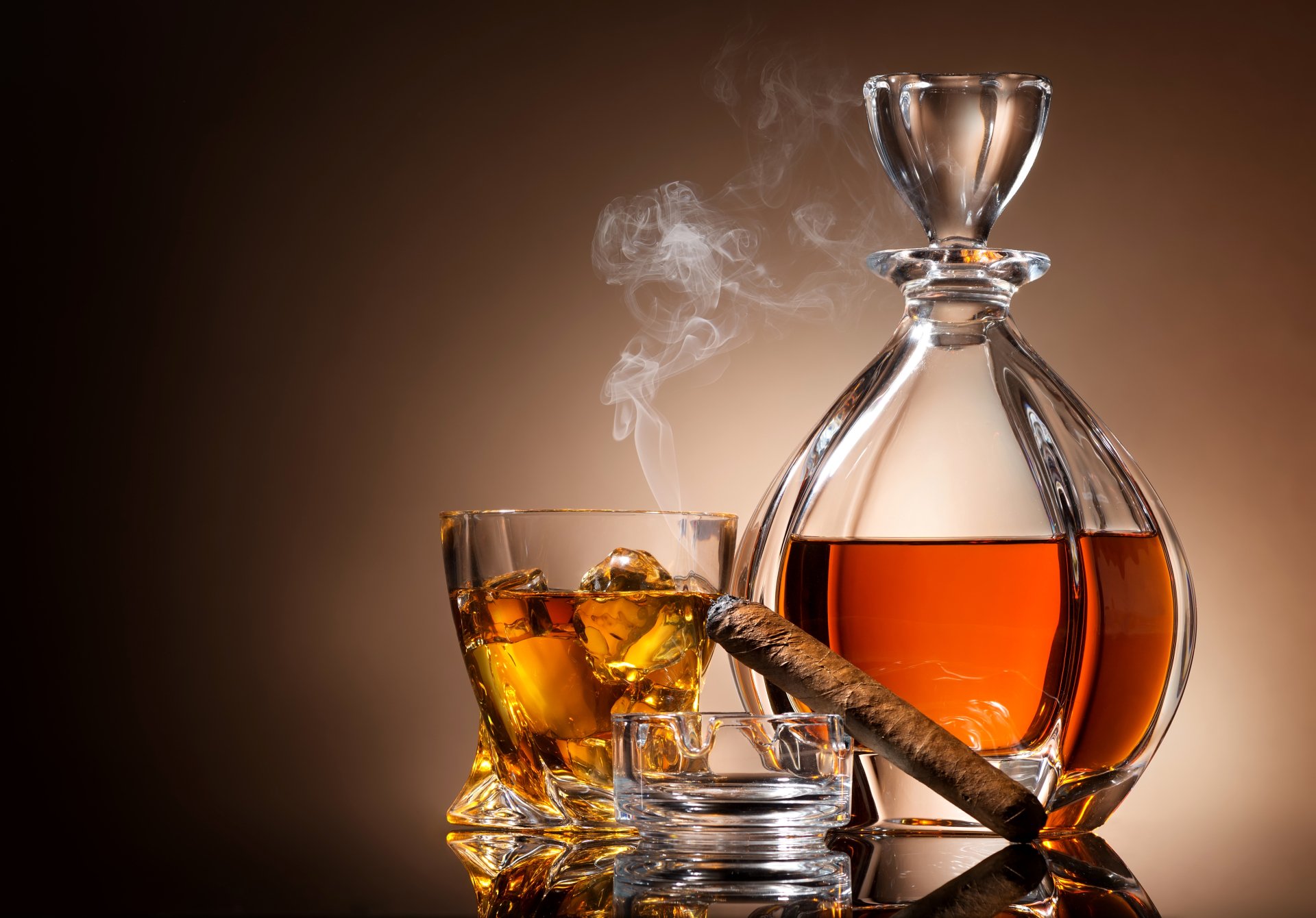 4K Ultra HD still life of a glass and decanter filled with amber alcohol, accompanied by a lit cigar resting on an ashtray, against a warm brown background.