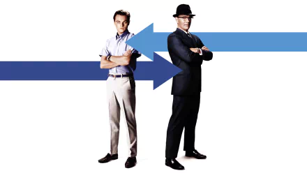 HD PC desktop wallpaper showing two men back-to-back—one casual, one in a suit and hat—on a white background with intersecting blue arrows; movie artwork for Catch Me If You Can.