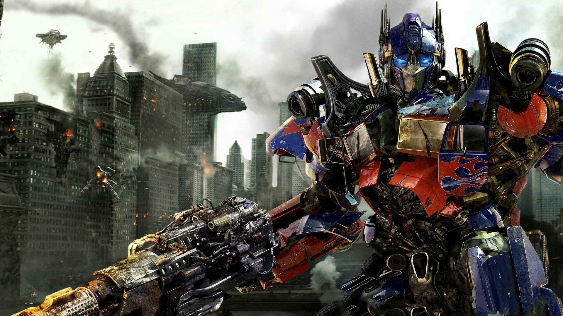 HD PC desktop wallpaper featuring Optimus Prime from Transformers: Dark of the Moon amidst a battle-damaged cityscape.