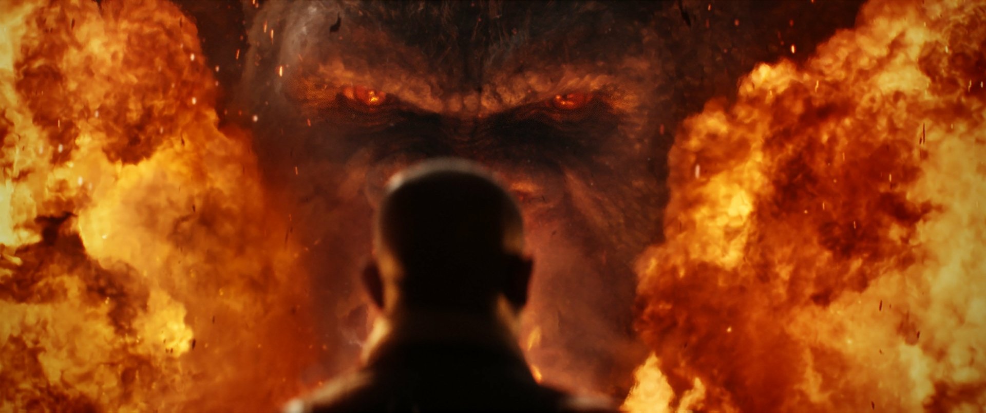 HD PC desktop wallpaper featuring a fiery close-up of Kong’s intense eyes from the movie Kong: Skull Island.