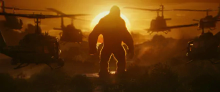 HD desktop wallpaper from Kong: Skull Island featuring Kong standing against a sunset, surrounded by helicopters.
