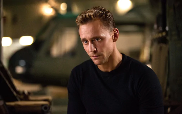 Tom Hiddleston from the movie Kong: Skull Island in a dimly lit setting, featured in a 4K Ultra HD PC desktop wallpaper and background.