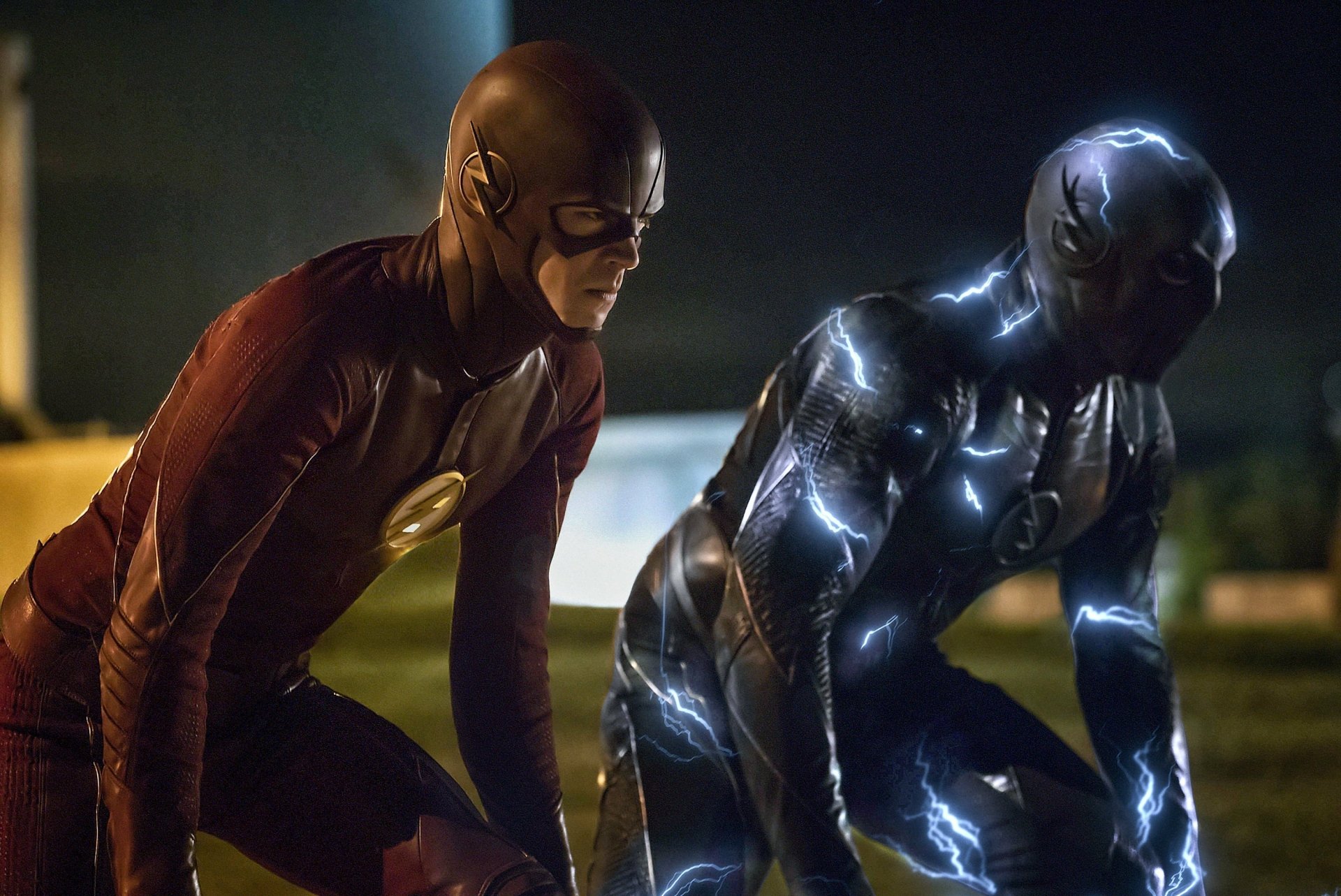 HD wallpaper featuring Barry Allen as The Flash and Zoom from the 2014 TV show The Flash, portrayed by Grant Gustin and Teddy Sears, respectively, ready to race.